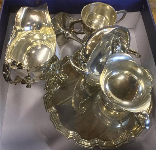 A silver gravy boat, a silver bon bon dish, a modern silver card tray and two silver trophies